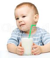 Cute little boy with a glass of milk