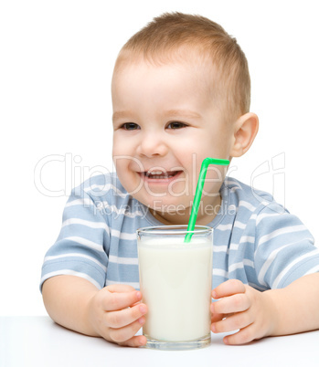 Cute little boy with a glass of milk