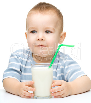 Cute little boy with a glass of milk