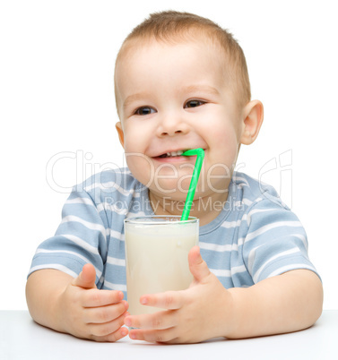 Cute little boy with a glass of milk