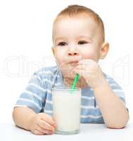 Cute little boy with a glass of milk