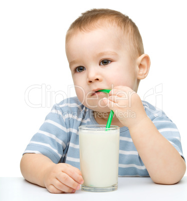 Cute little boy with a glass of milk