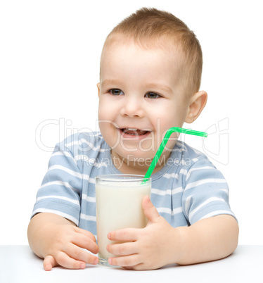 Cute little boy with a glass of milk