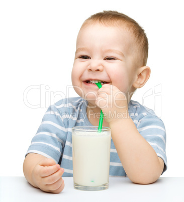 Cute little boy with a glass of milk