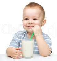 Cute little boy with a glass of milk