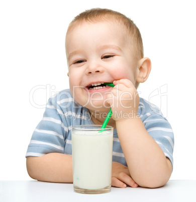 Cute little boy with a glass of milk