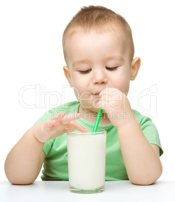 Cute little boy with a glass of milk