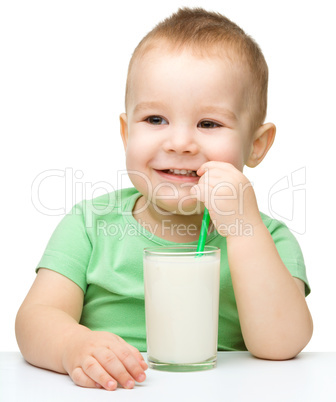 Cute little boy with a glass of milk