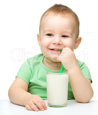 Cute little boy with a glass of milk