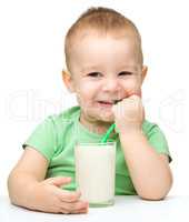 Cute little boy with a glass of milk