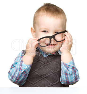 Portrait of a cute little boy wearing glasses