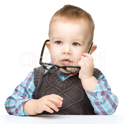 Portrait of a cute little boy wearing glasses