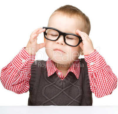 Portrait of a cute little boy wearing glasses