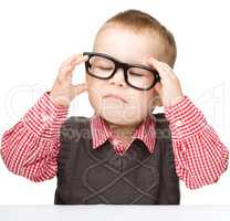 Portrait of a cute little boy wearing glasses