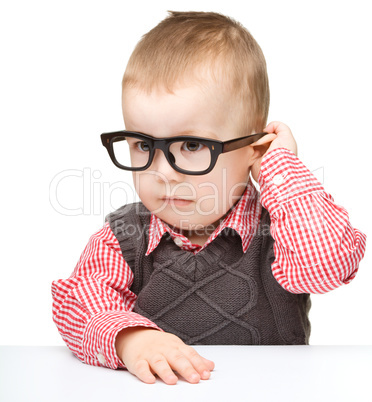 Portrait of a cute little boy wearing glasses