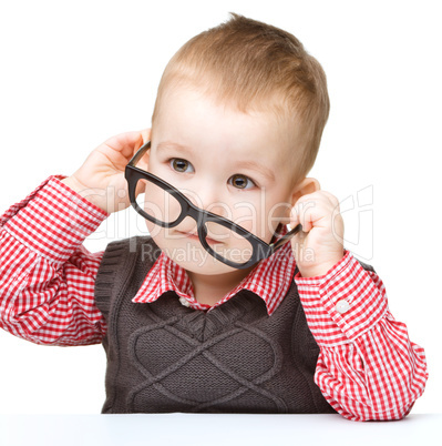 Portrait of a cute little boy wearing glasses