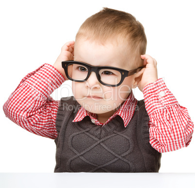 Portrait of a cute little boy wearing glasses