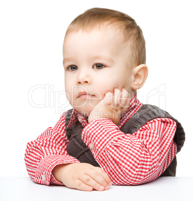 Portrait of a cute and pensive little boy