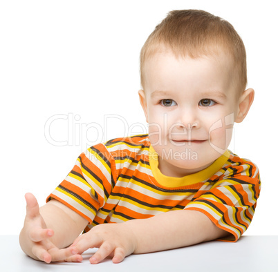 Portrait of a cute little boy looking at something