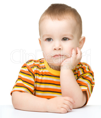 Portrait of a cute and pensive little boy