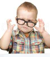 Portrait of a cute little boy wearing glasses