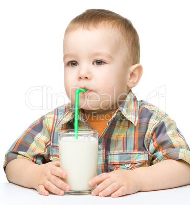 Cute little boy with a glass of milk