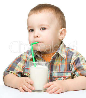 Cute little boy with a glass of milk