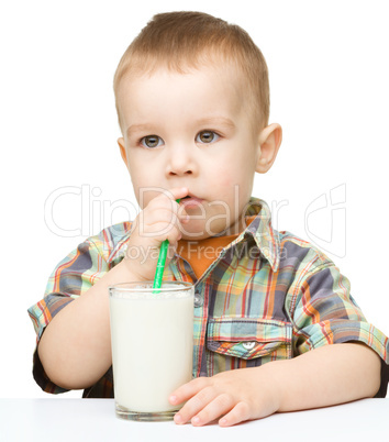 Cute little boy with a glass of milk