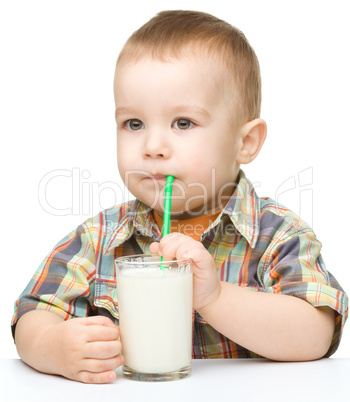 Cute little boy with a glass of milk