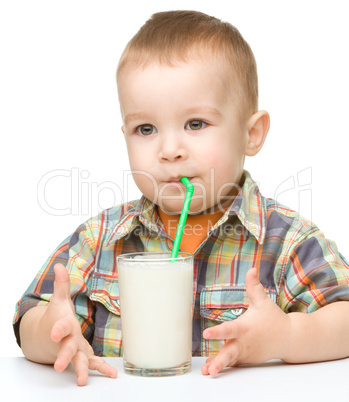 Cute little boy with a glass of milk