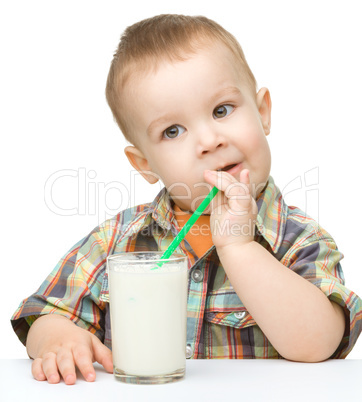 Cute little boy with a glass of milk