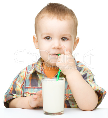 Cute little boy with a glass of milk