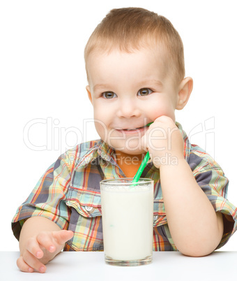 Cute little boy with a glass of milk