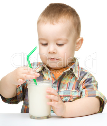 Cute little boy with a glass of milk