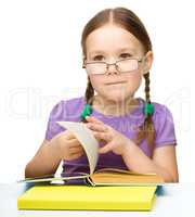 Little girl with books