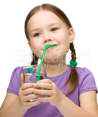 Cute little girl with a glass of pure water