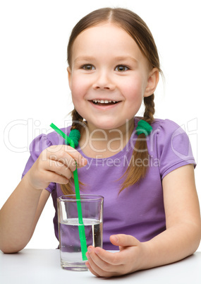 Cute little girl with a glass of water