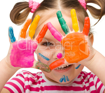 Portrait of a cute girl with painted hands