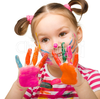 Portrait of a cute girl with painted hands