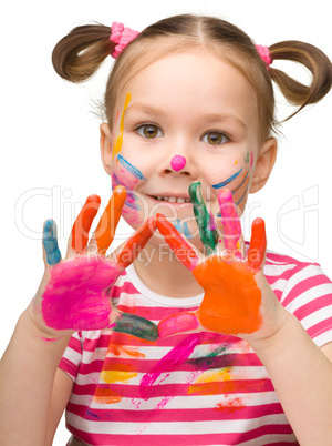 Portrait of a cute girl with painted hands