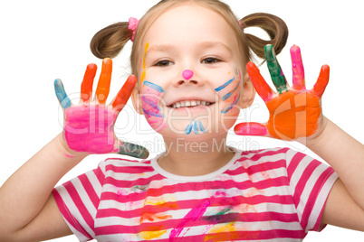 Portrait of a cute girl with painted hands