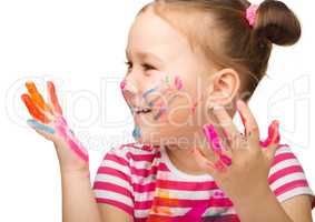Portrait of a cute girl with painted hands