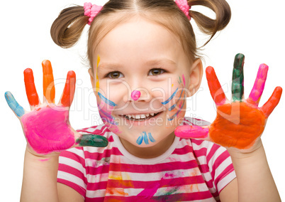 Portrait of a cute girl with painted hands