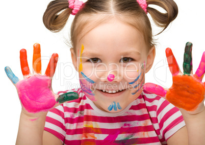 Portrait of a cute girl with painted hands