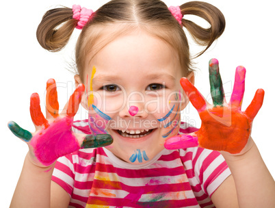 Portrait of a cute girl with painted hands