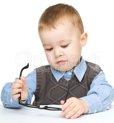 Portrait of a cute little boy wearing glasses