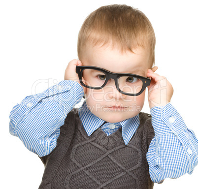 Portrait of a cute little boy wearing glasses