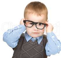 Portrait of a cute little boy wearing glasses