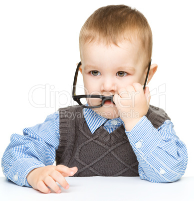 Portrait of a cute little boy wearing glasses