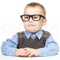 Portrait of a cute little boy wearing glasses